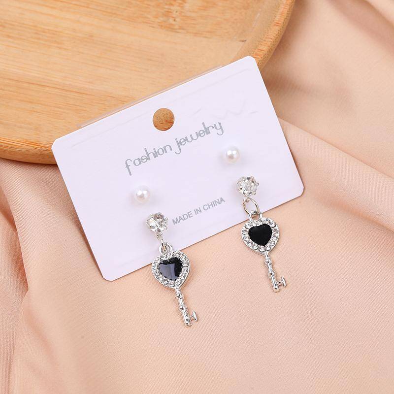 Two pairs of pearl and diamond stud earrings -21